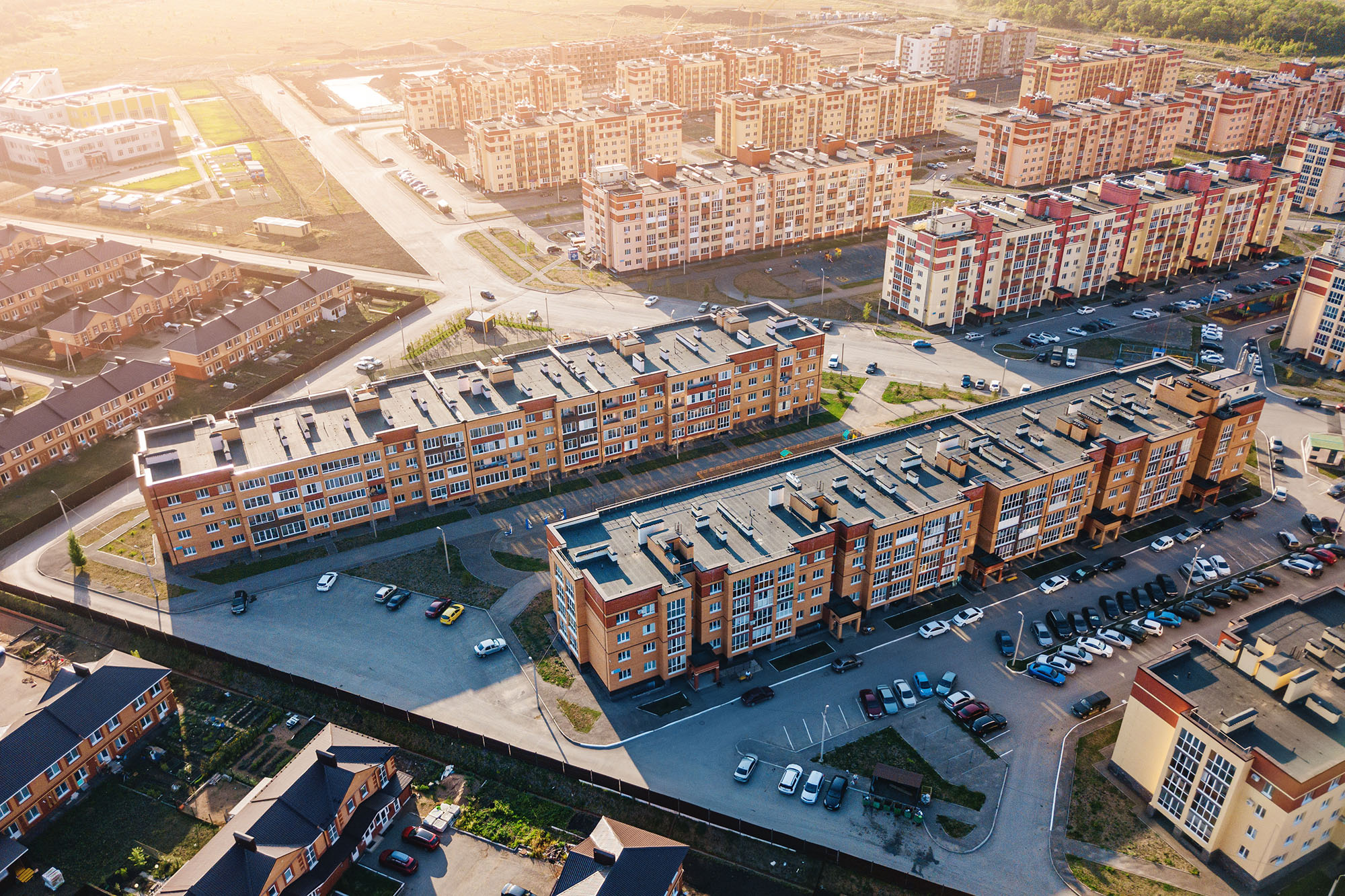 Residential quarter of the aerial suburb with a low-rise new housing development