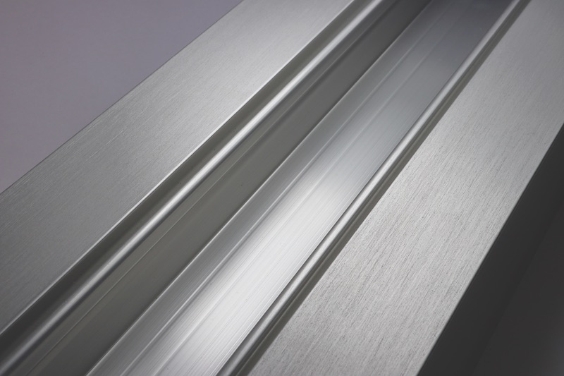 A closeup of brushed stainless anodize