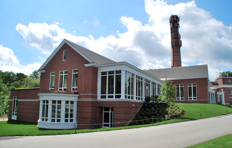 The exterior of the Rachel Carson Music and Campus Center, with the 19th century smokestack visible.