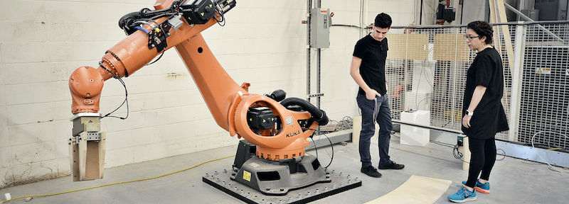 Virginia Tech Students with a construciton robot