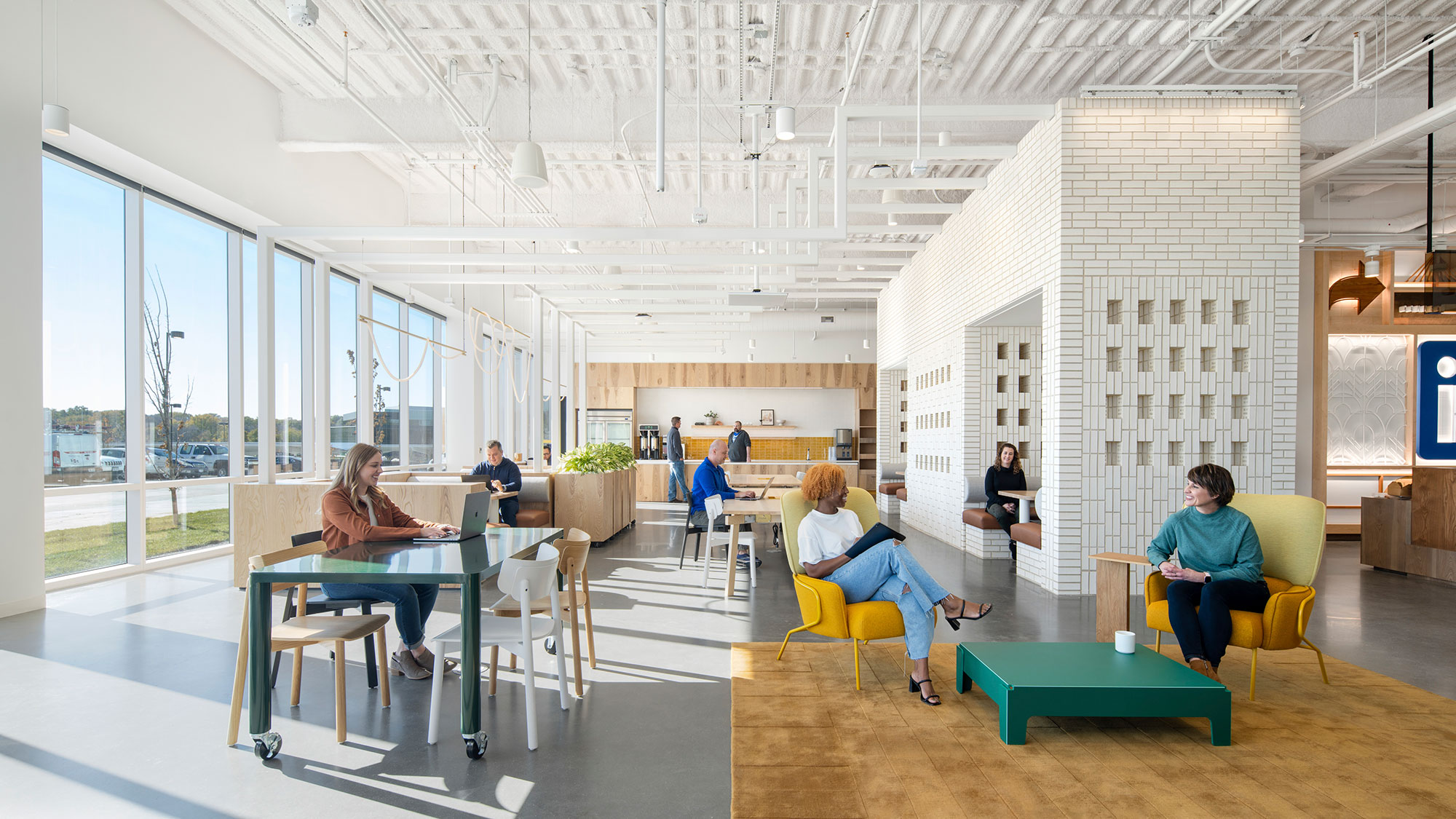 People working in a variety of spaces inside LinkedIn's Omaha, Nebraska office.