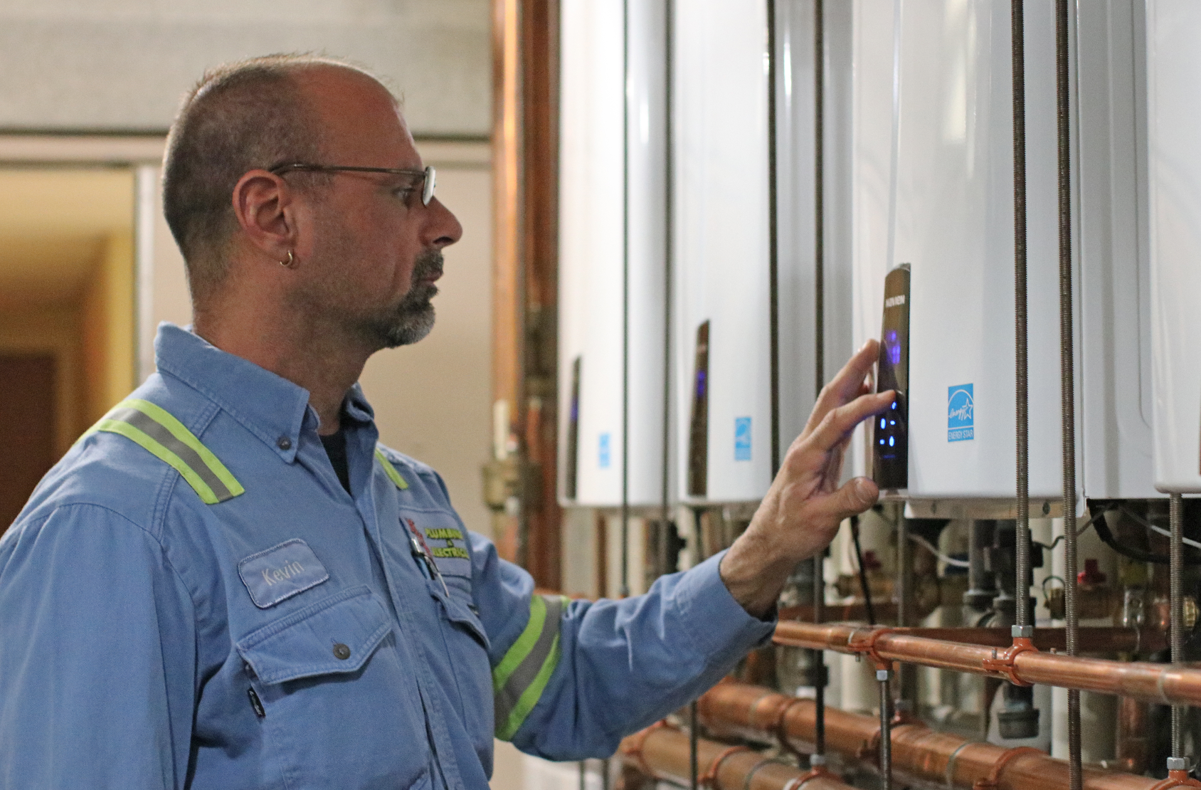 Contractor checks tankless water heaters in PA