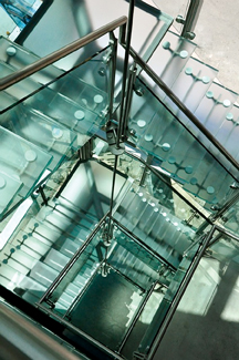 The use of light load-bearing glass to create transparent stairs, floors, and ot