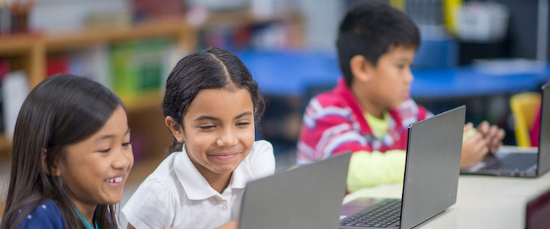 Children working on laptops