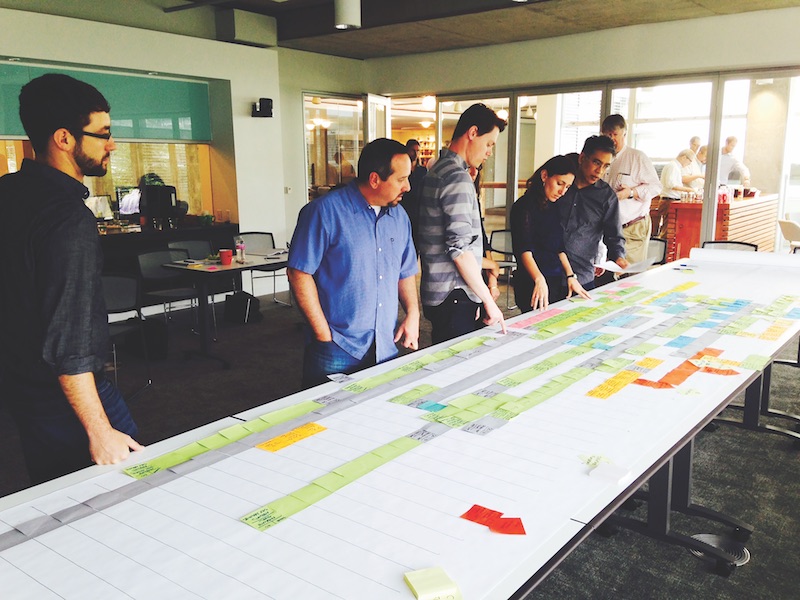 A project team in Skanska’s Seattle office works with design partners in a Lean pull planning session for a development in downtown Seattle.