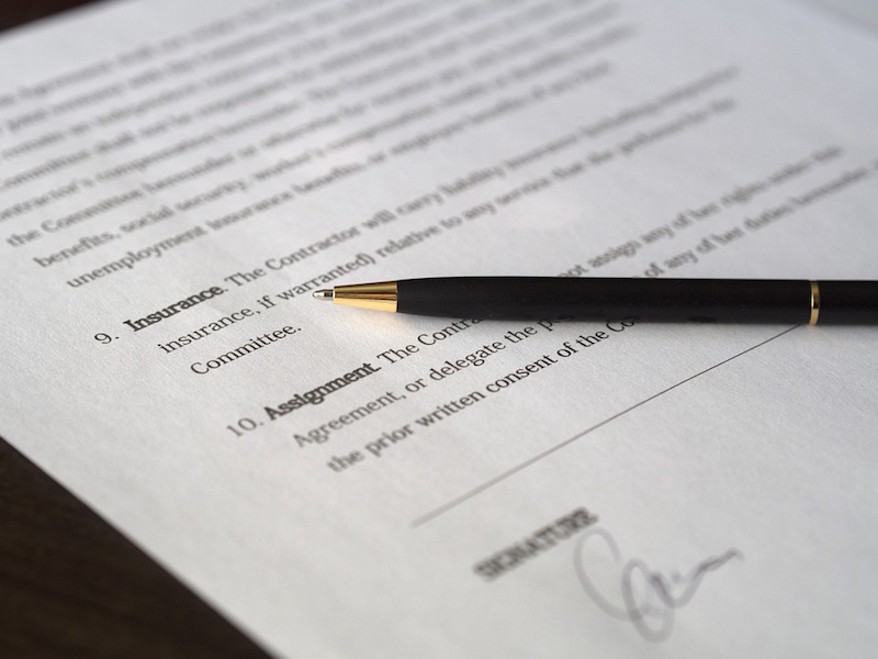 A pen sitting on top of a contract