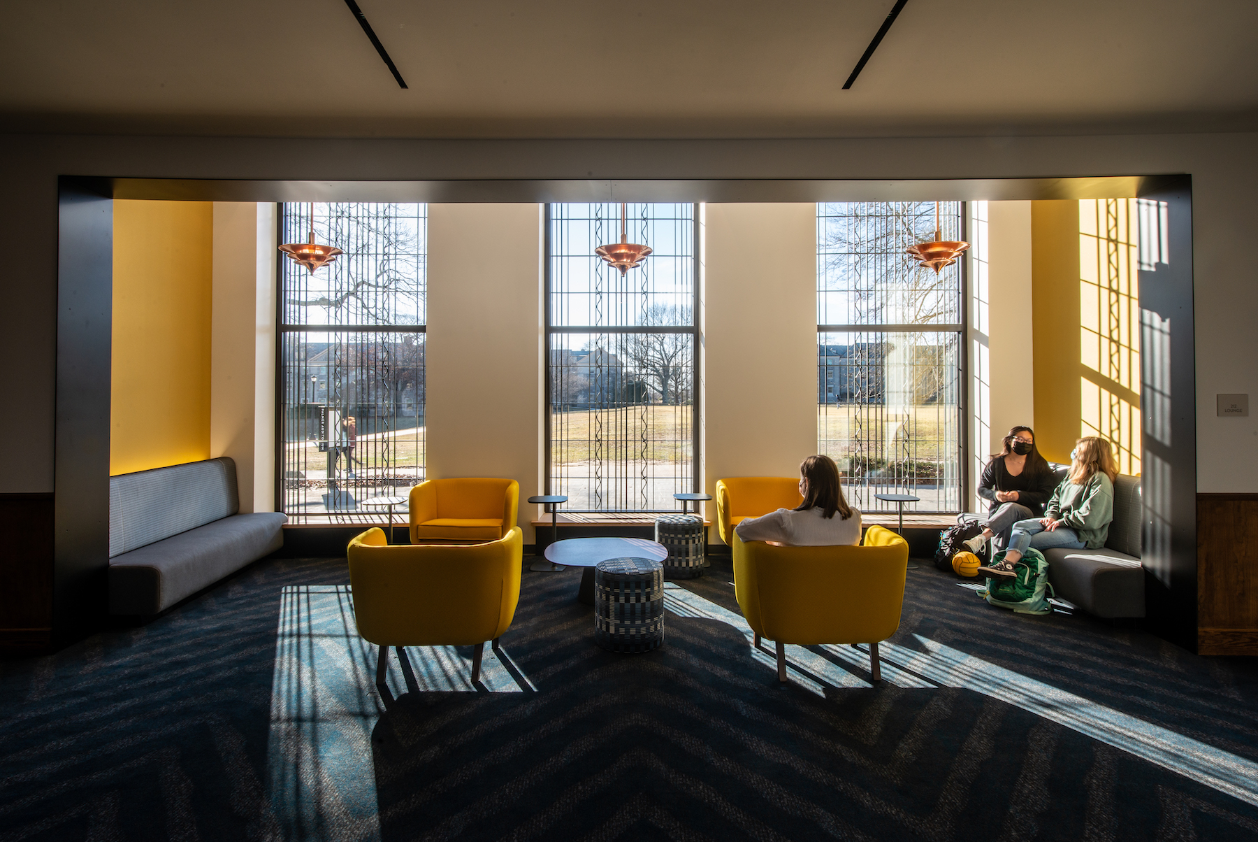 The building's lobby features new furniture and large windows