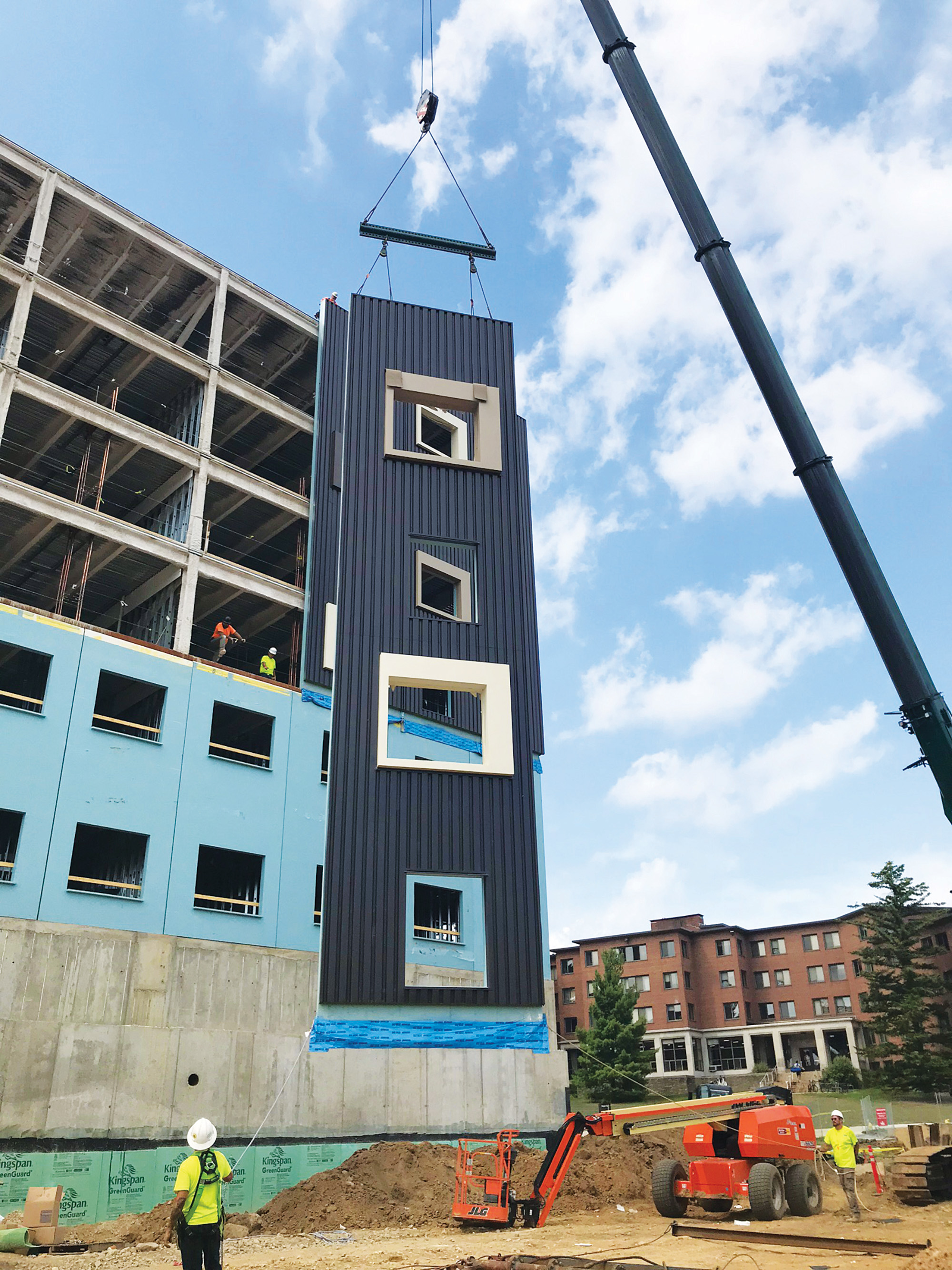Prefabricated panels being put onto student housing development