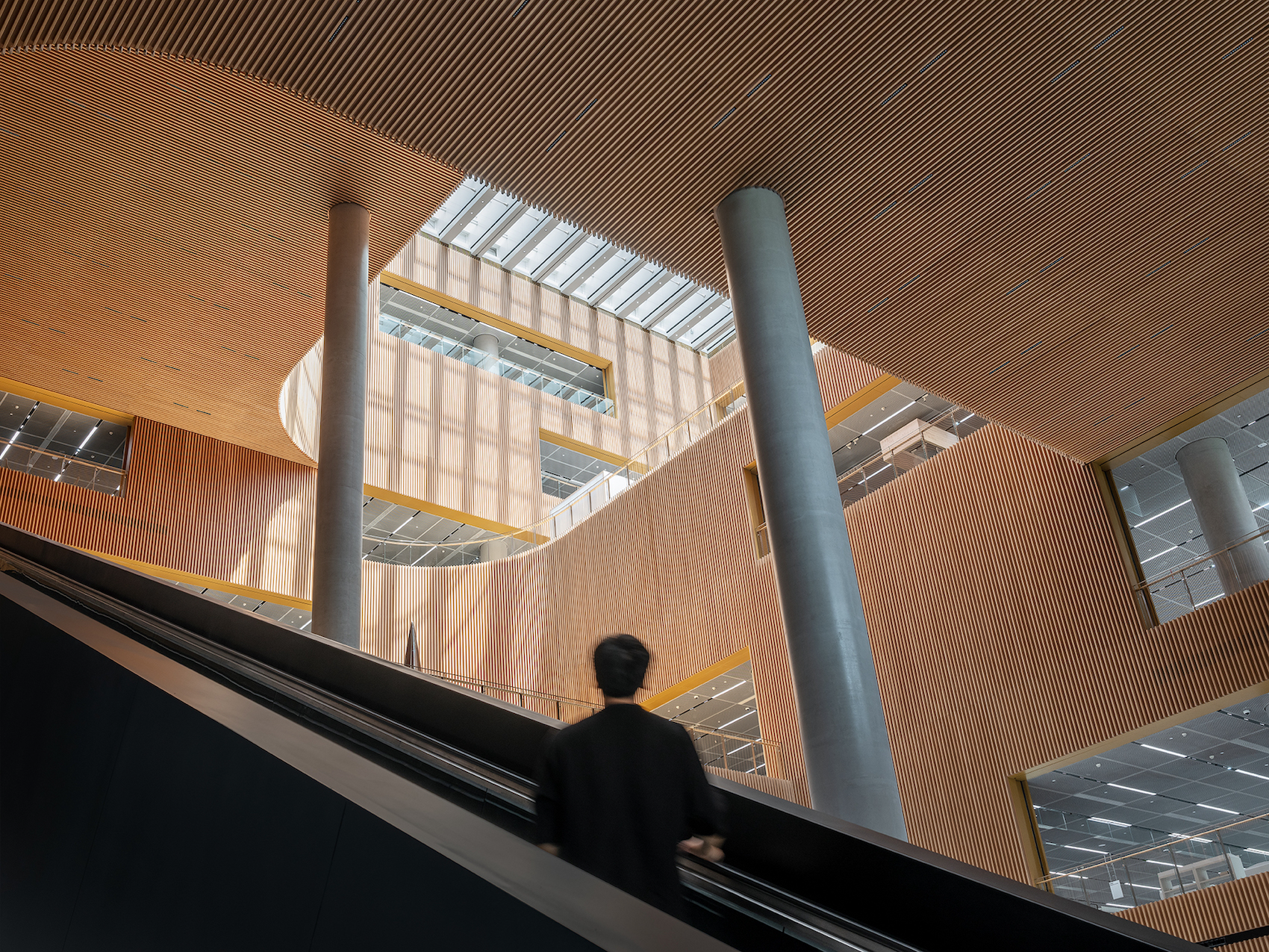 An expansive atrium connects the library's seven floors. Credit Tian Fangfang