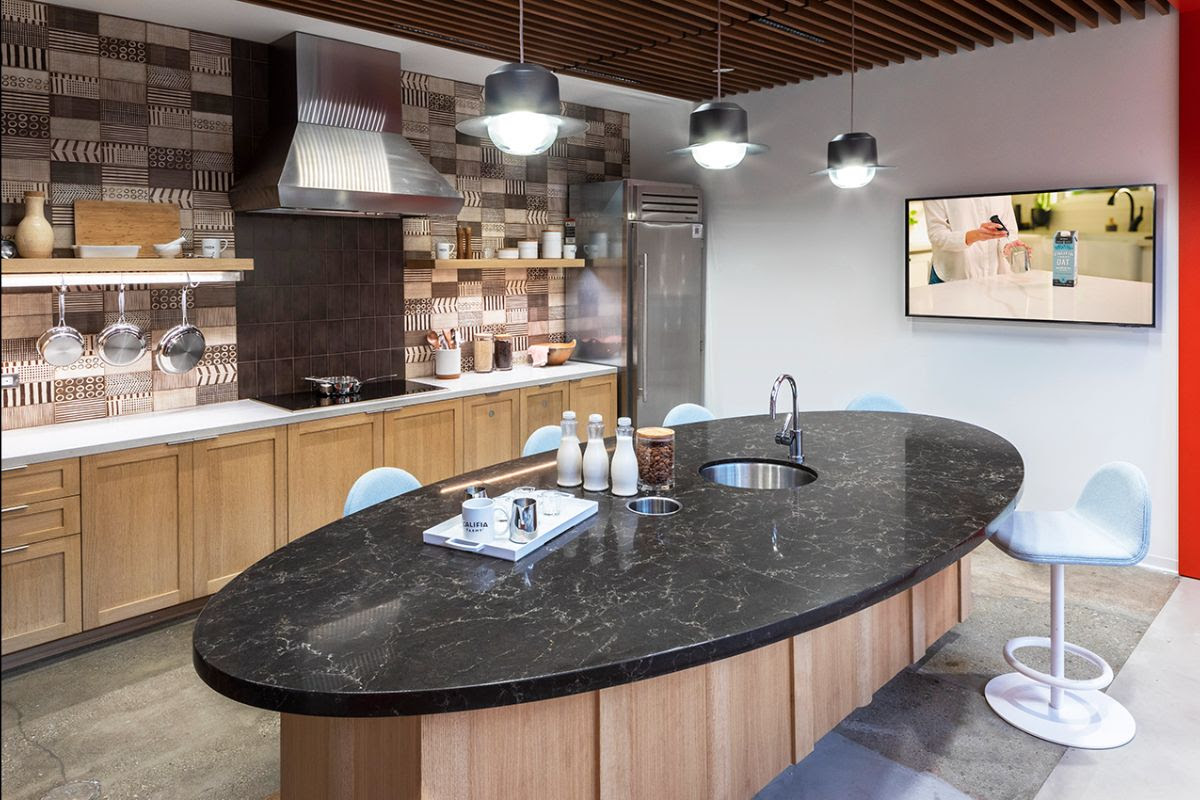 Food and beverage-inspired amenities like the office café bar and tasting room reflects the brand experience. Photo by SLAM