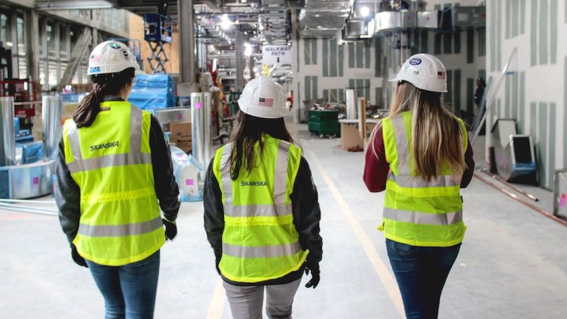 3 women wearing Skanska's new line of PPE