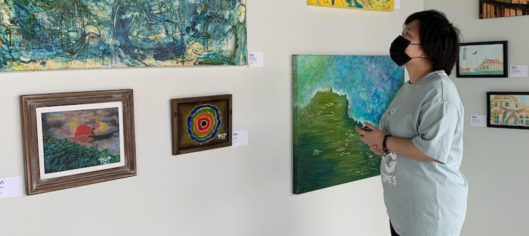 A patron takes in the latest collection at Arthaus's gallery, in Allston, Mass. Photo: Unbound Visual Arts
