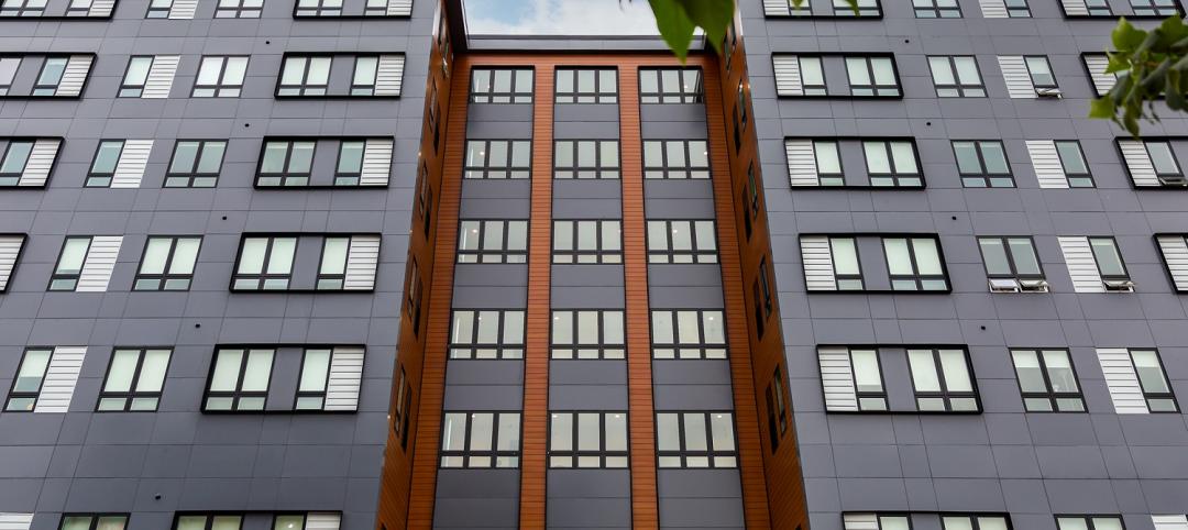 Exterior of a modern multifamily building with contrasting color scheme, sleek blackwindows and no visible HVAC equipment.