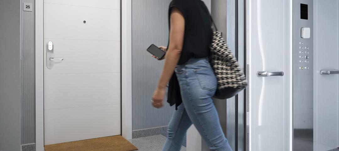 A woman uses her iPhone to access the elevator and her apartment door.