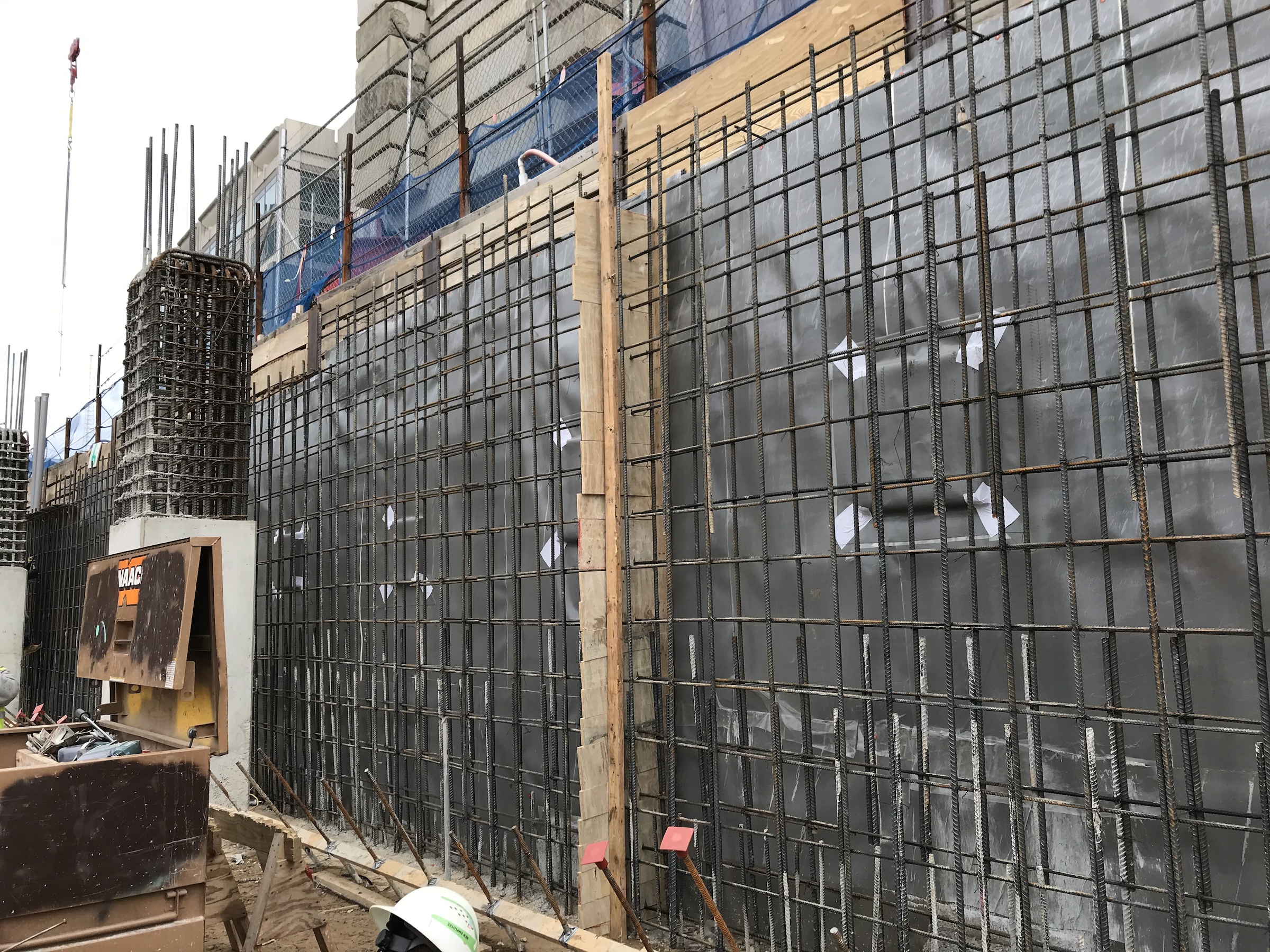 Pre-applied blindside waterproofing installed prior to pouring of concrete wall. Photo courtesy Walter P Moore