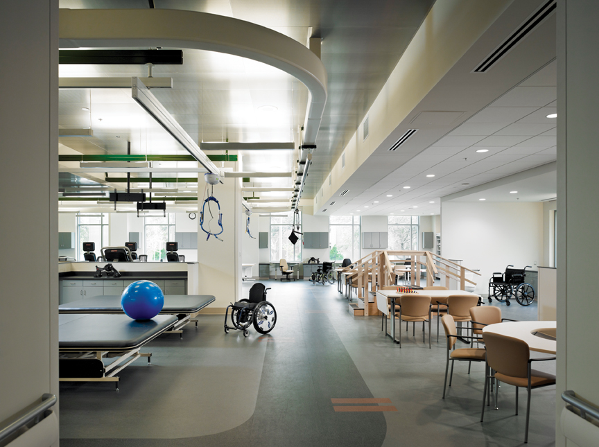 Metal tiles were used in the physical therapy gymnasium to give the space a more