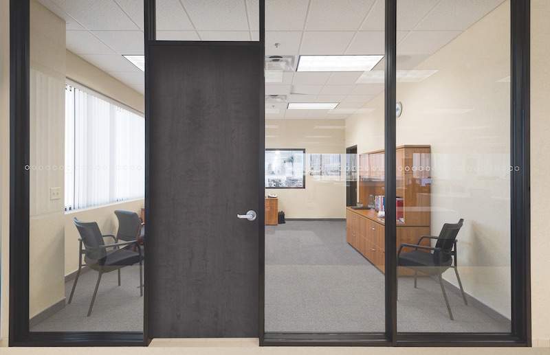 A double-glazed, demountable interior office partition system