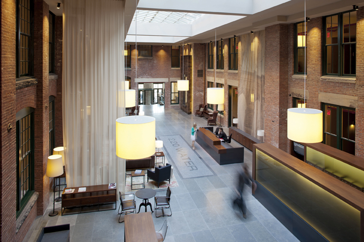Formerly an open-air courtyard, the two-story grand lobby is now the centerpiece