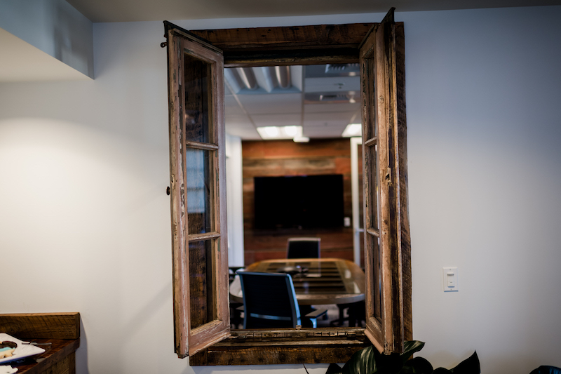 Window made from reclaimed barn wood in the Mortenson Construction Office