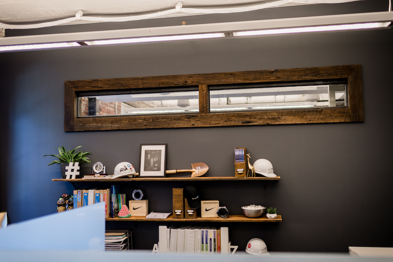 Wood trim from the repurposed barn in a Mortenson Construction workspace