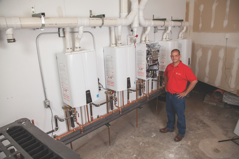 Jason Richards, A+ Plumbing Heating and Cooling, with Navien NPE-240A tankless water heaters