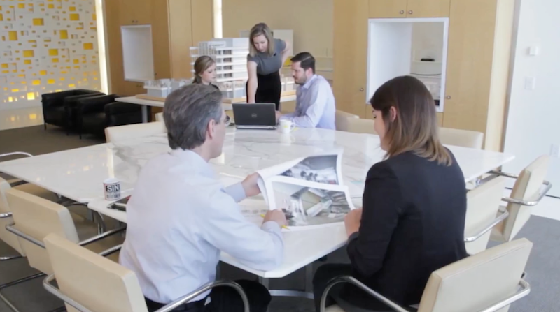 Five people work together in a PDR office meeting space
