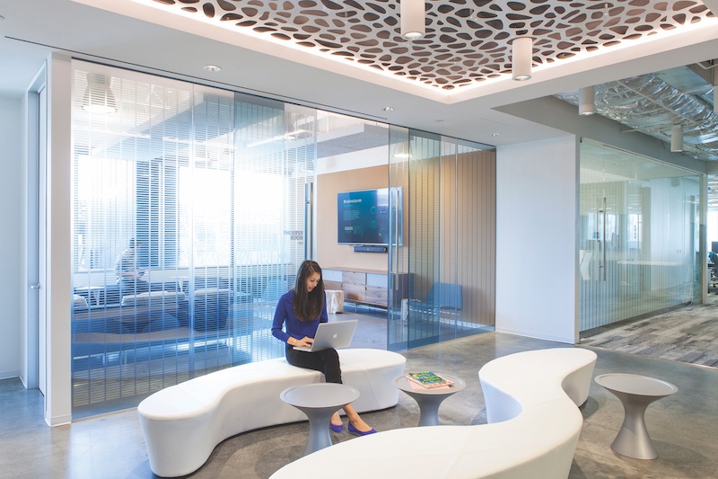 Mindshare’s 41,500-sf office, on 2½ floors in a building in Playa Vista, Calif., is a shared workspace for eight creative firms. Organized as a series of  “neighborhoods,” the interior office design employs an abundance of interior glass as part of a 100%-open environment.