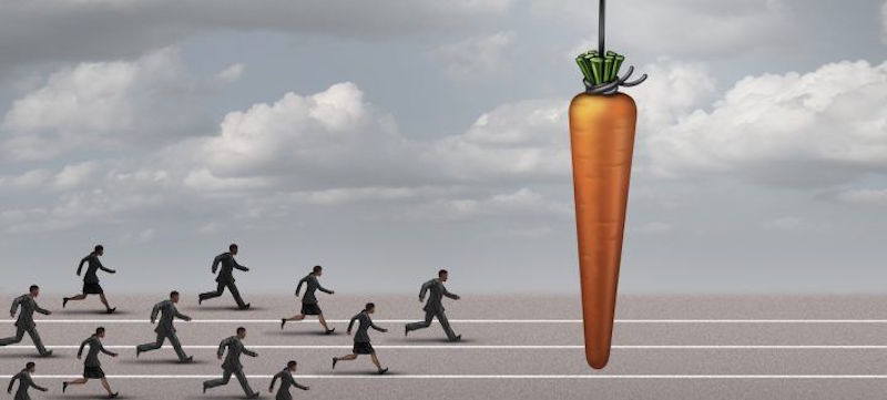 Image of people chasing a giant carrot
