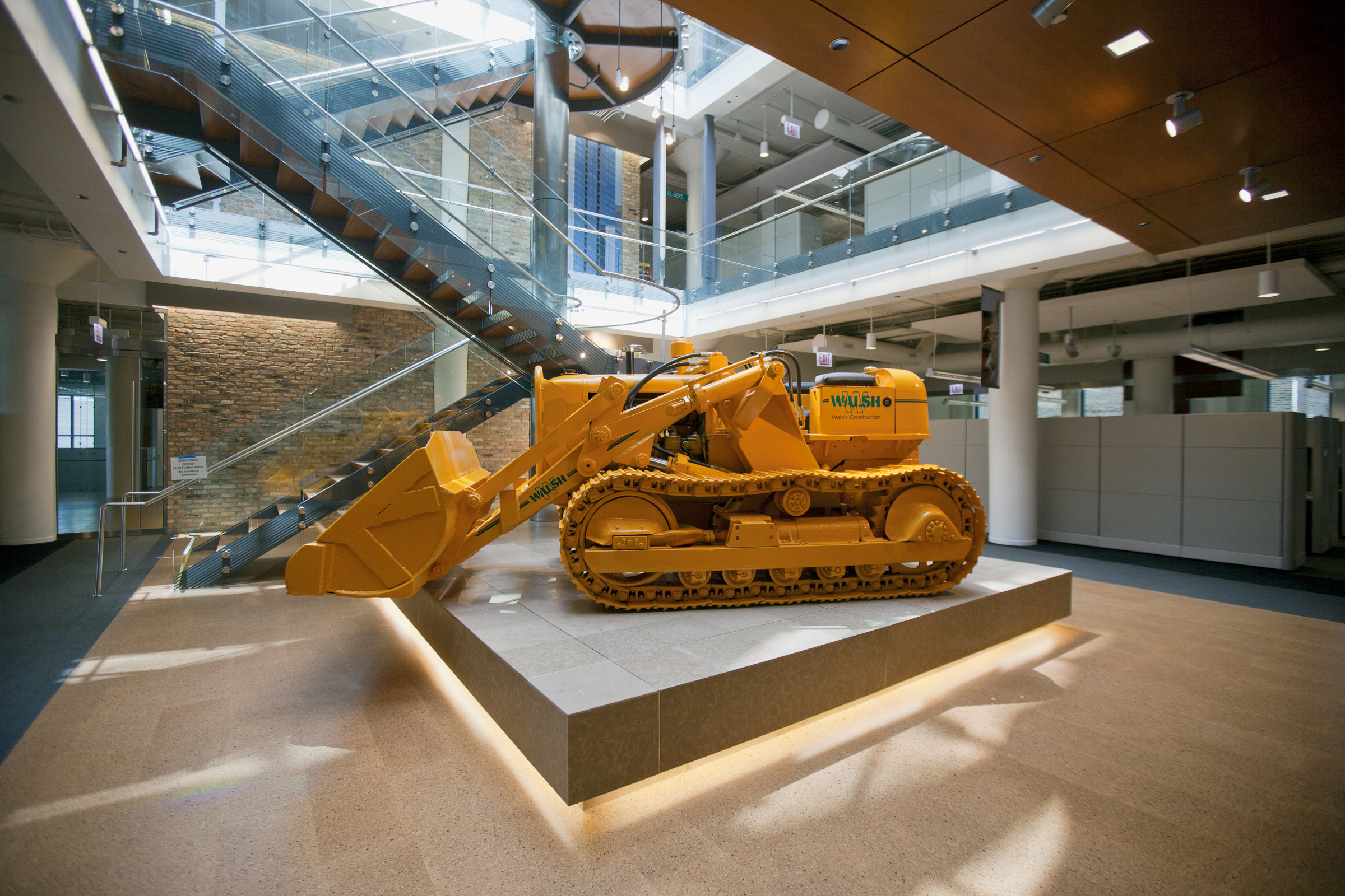 A 1953 Allis-Chalmers bulldozer in the central atrium of the Walsh Training and 