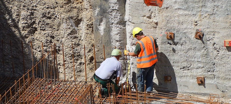 Two construction workers at a site