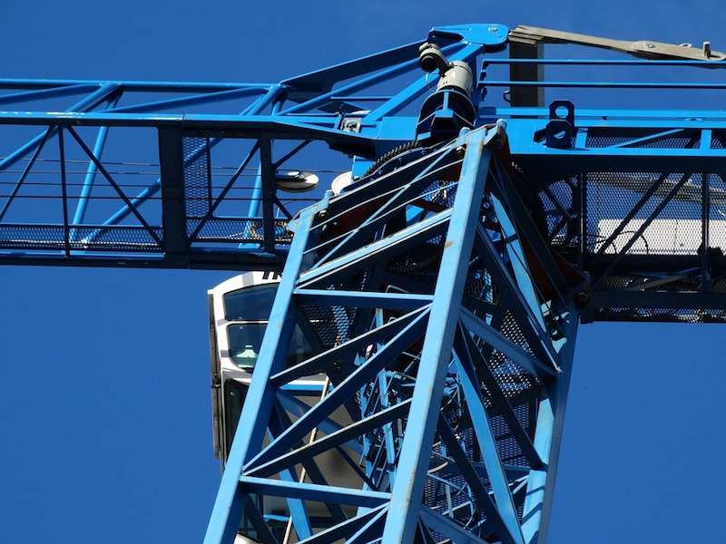 A crane against the blue sky