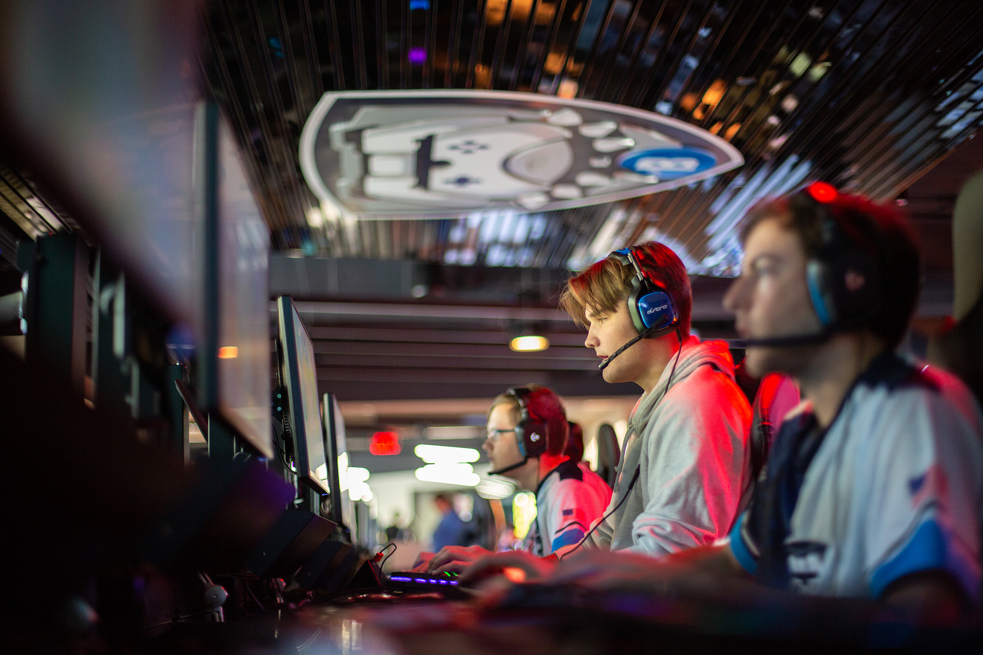 Gamers playing games in esports arena