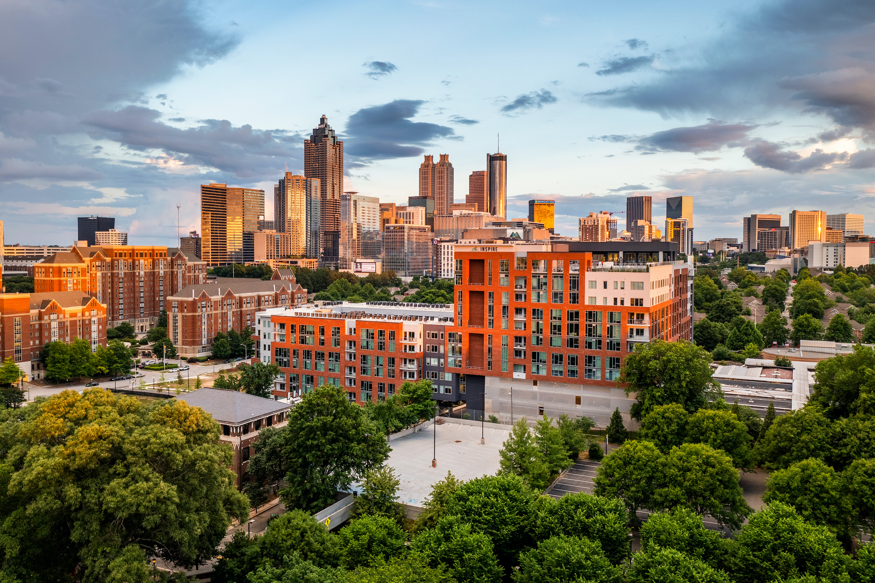 Inspire exterior with downtown Atlanta skyline