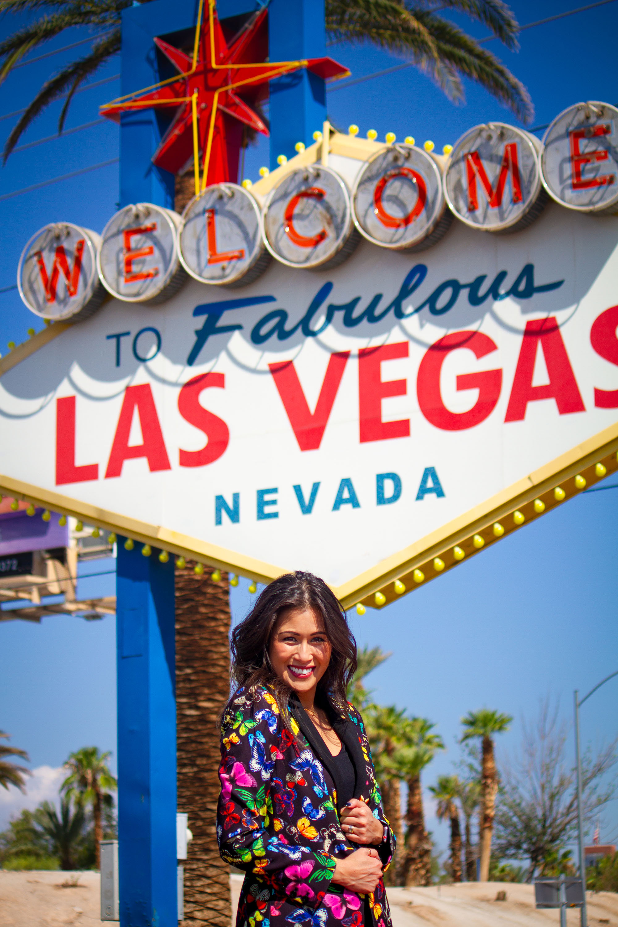 Mindy Haffke headshot in front of Las Vegas sign
