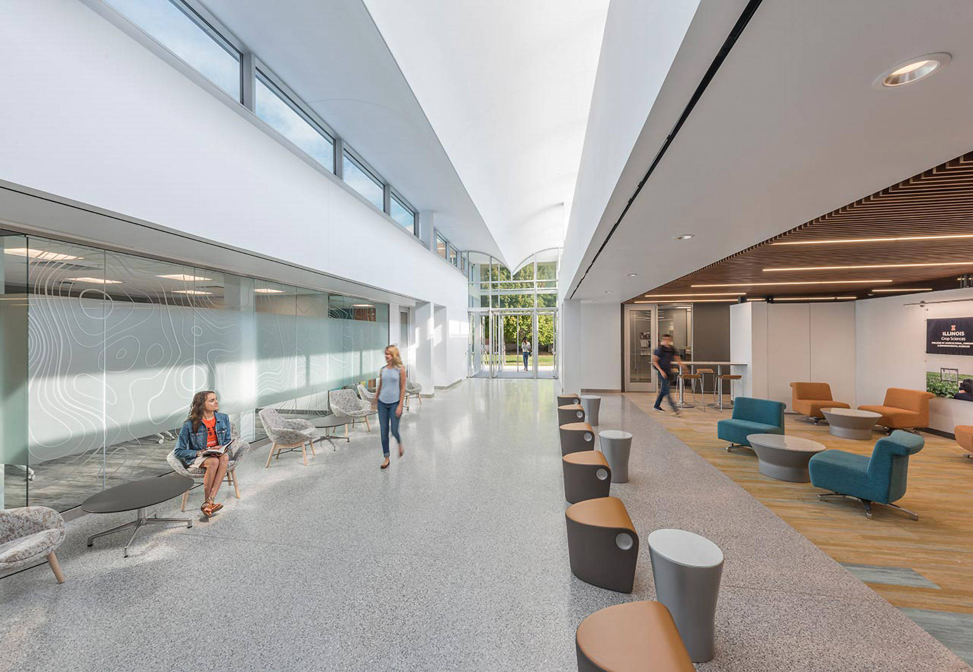Light-filled higher education atrium with seating areas for students