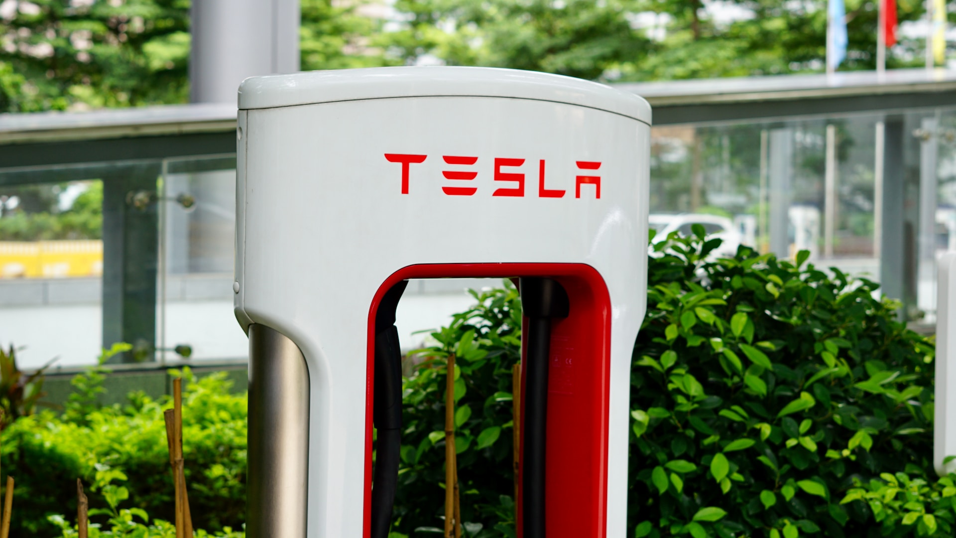 Electric vehicle chargers are top priority for corporate office renters - Photo by Neo Tan on Unsplash