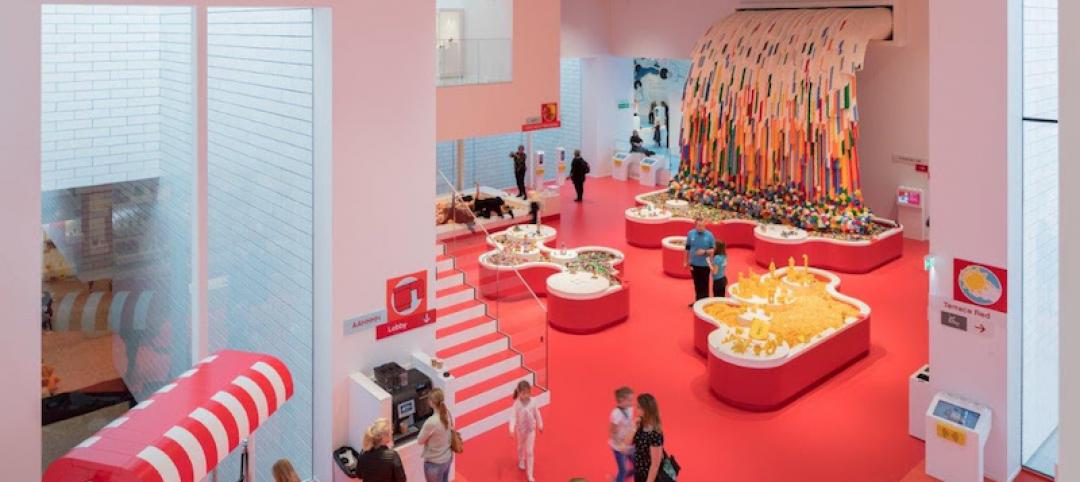 A red room in the LEGO House with a LEGO waterfall