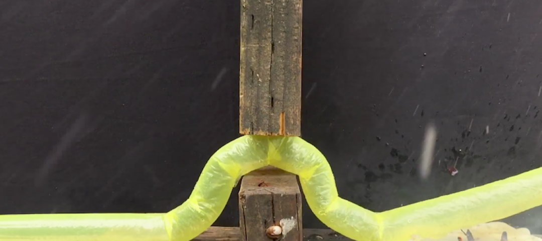 Stanford's snaking robot bending around and between two pieces of wood