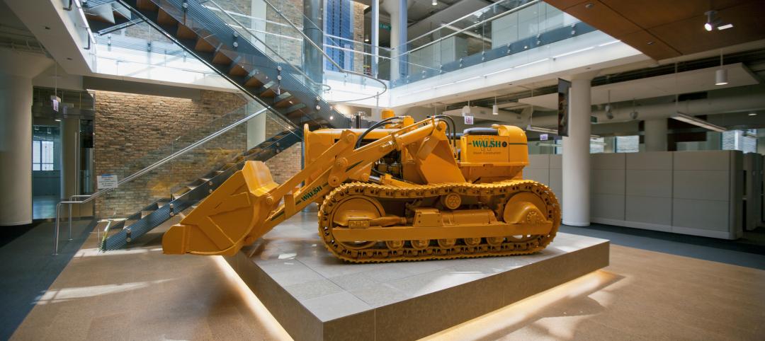 A 1953 Allis-Chalmers bulldozer in the central atrium of the Walsh Training and 
