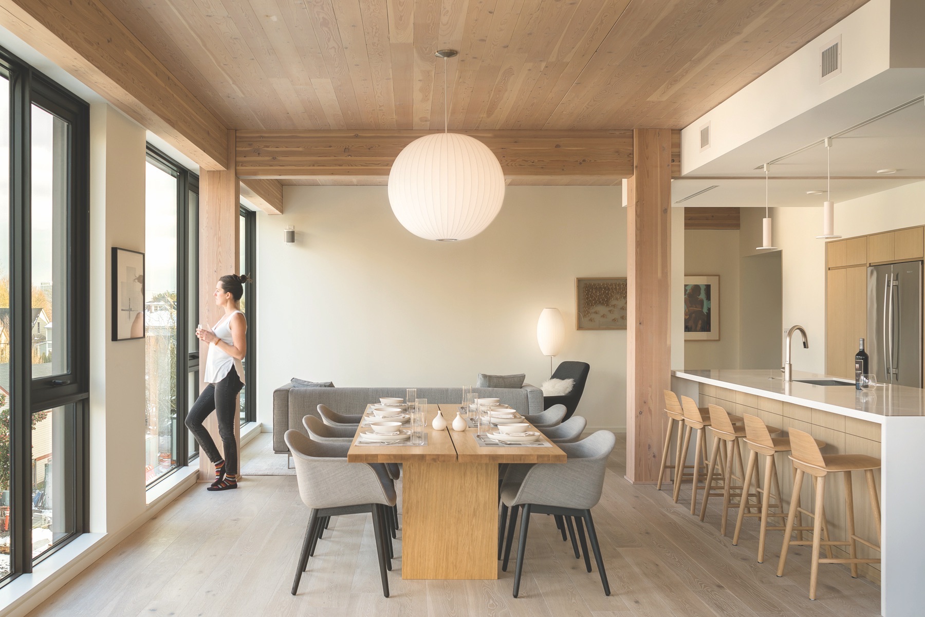 Mass timber for multifamily housing construction - Carbon12 dining room w person.jpeg