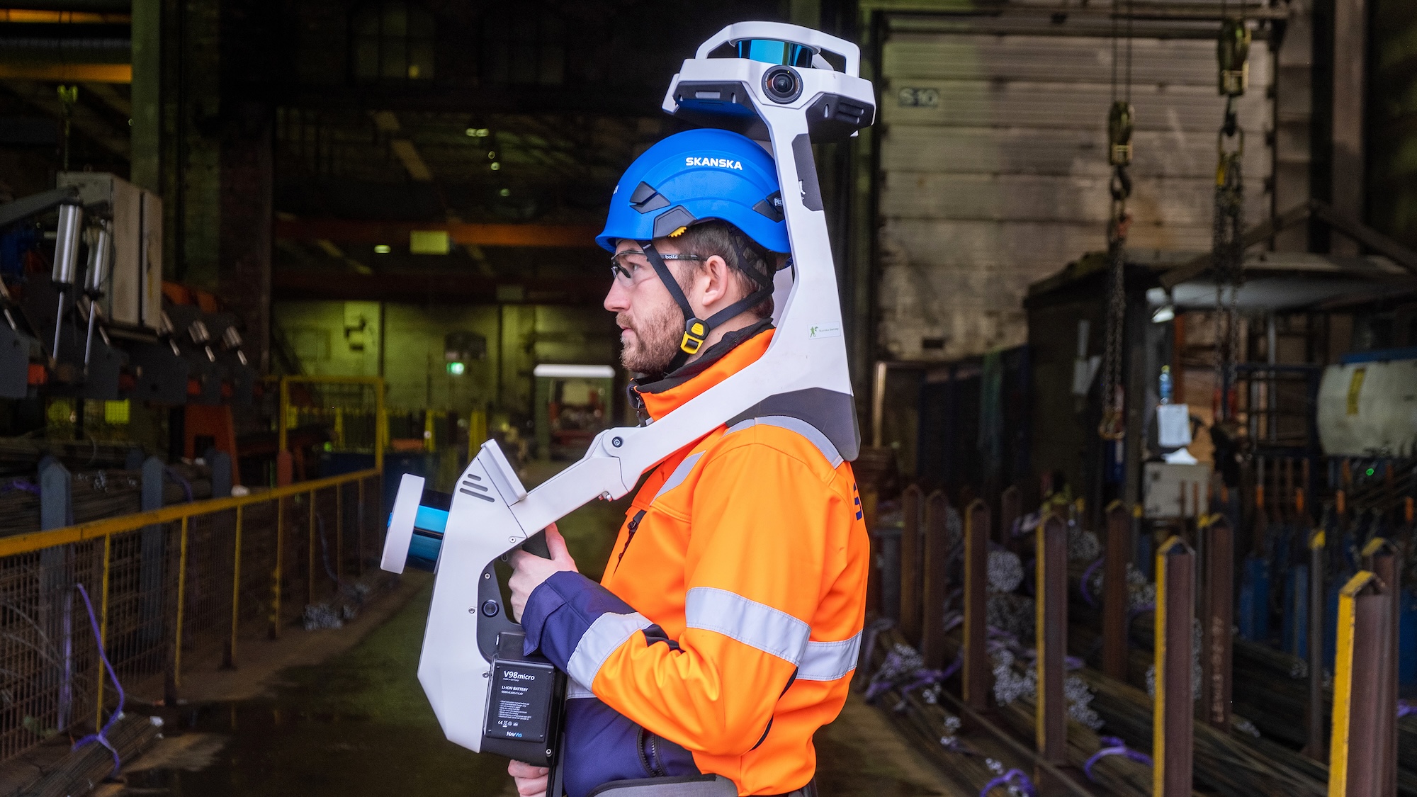 Skanska USA is exploring how AI can intersect with and enhance jobsite automation. Shown here are a Skanska worker using NavViz’s scanner to create digital models.