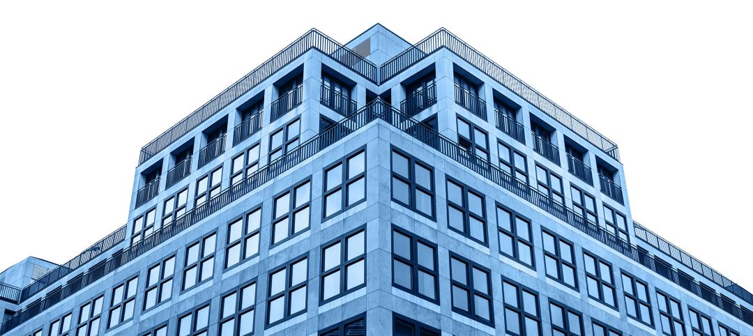 A residential building in trendy classic blue color with cut out sky with white isolated background.